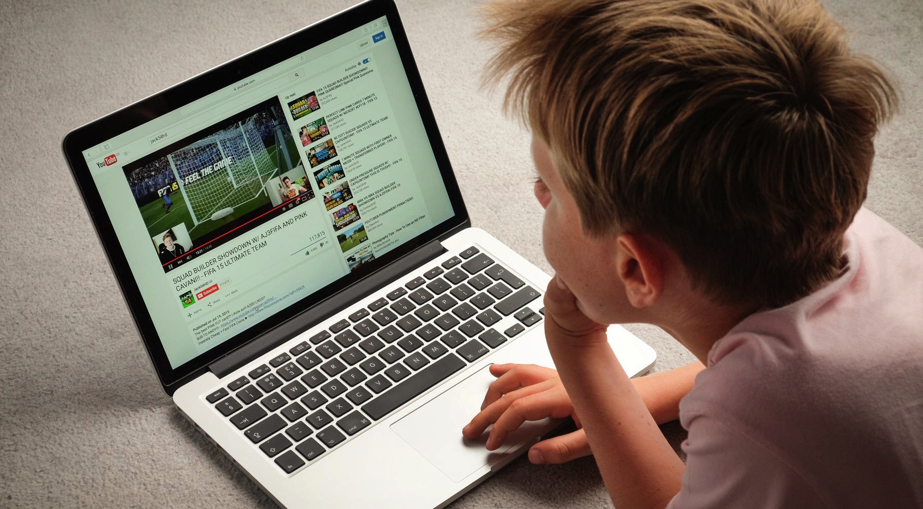 boy watching youtube on laptop