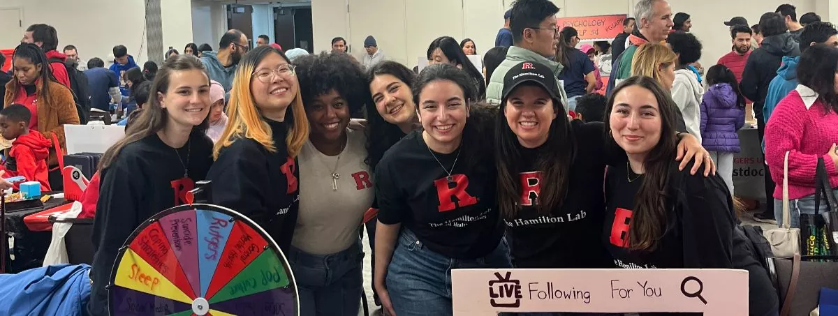 Group of Girls operating booth for the Hamilton Lab at Rutgers Day