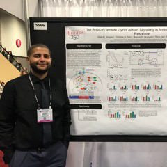 Mark Gergues with poster