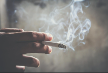 Person Holding Cigarette